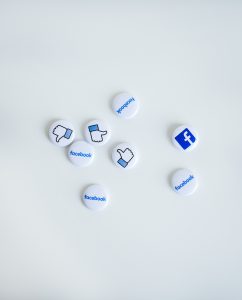 A collection of buttons with facebook logos.