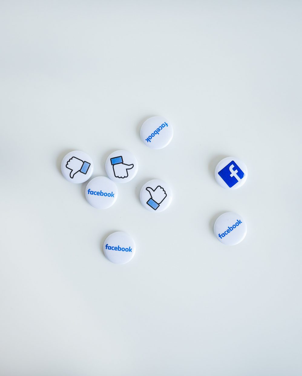 A collection of buttons with facebook logos.